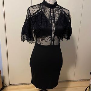 Black laced, body hugging dress
